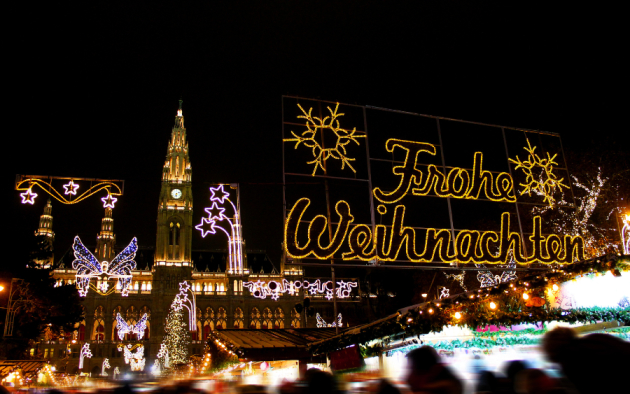 Vienna Christmas World at Rathausplatz at night illuminated with Christmas lights