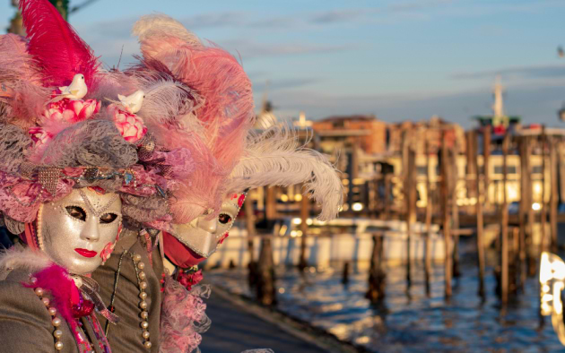 Venice Carnival attendees wearing costumes