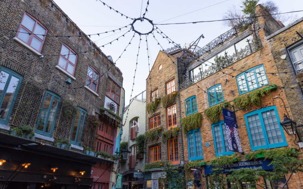 Colourful shopfronts and fairy lights in Neal's Yard, Covent Garden, London