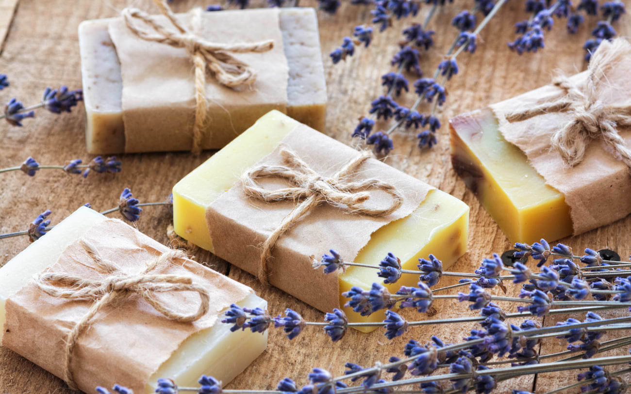 Artisanal French soaps stacked in a market stall