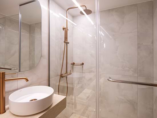 Modern bathroom in Superior Room with Balcony at Leonardo Hotel Athens City Center