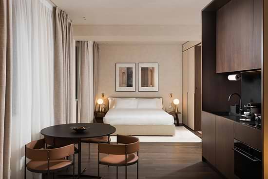 Large Studio with Balcony - Bed and Dining table