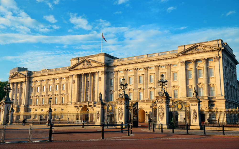 Buckingham Palace facade at golden hour with Union Jack flag, London