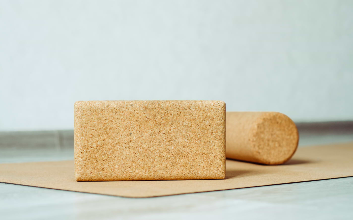 Portuguese cork yoga block and rolled cork mat, showcasing sustainable cork products made in Portugal.