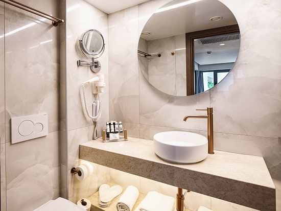 Modern bathroom in Standard Room at Leonardo Hotel Athens City Center