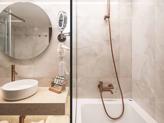 Modern bathroom in Junior Suite at Leonardo Hotel Athens City Center