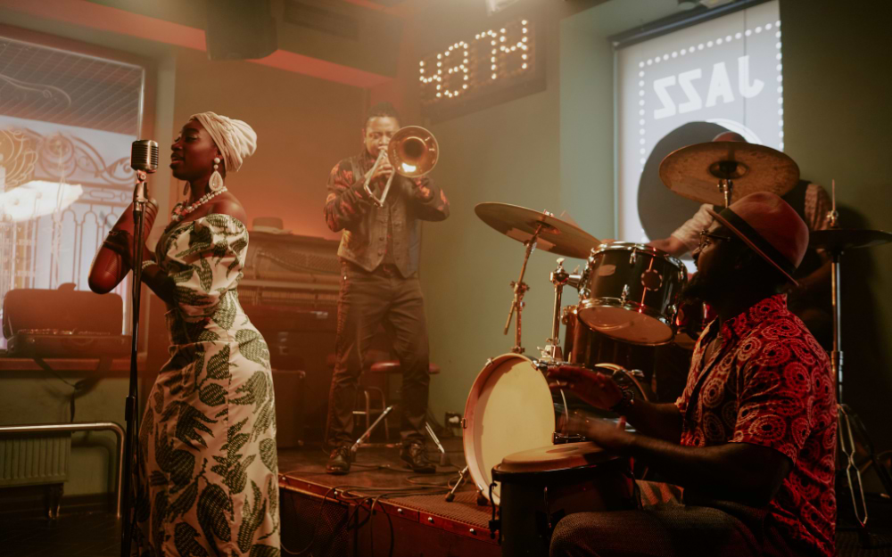 Cozy jazz club ambiance with a live band performing on a small stage in Paris