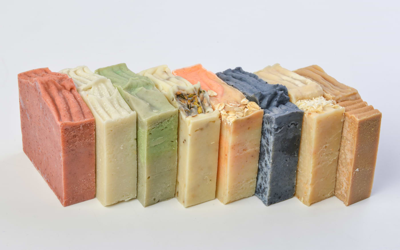Row of colorful handmade Portuguese soap bars in different scents and natural ingredients, a popular souvenir.