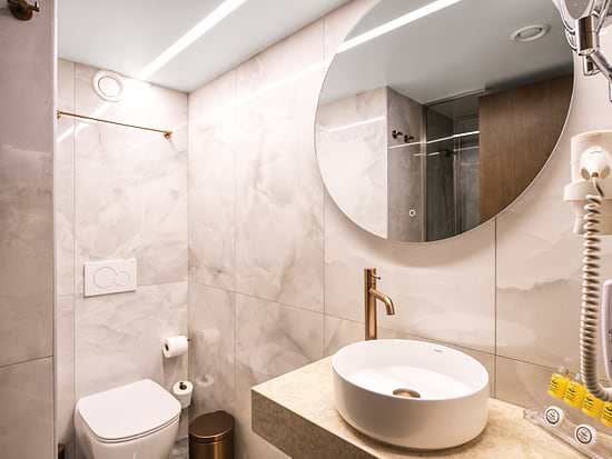 Modern bathroom in Standard Room at Leonardo Hotel Athens City Center
