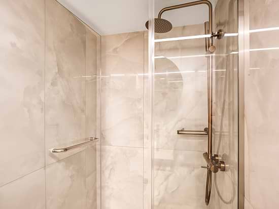 Walk-in shower in Standard Triple Room at Leonardo Hotel Athens City Center
