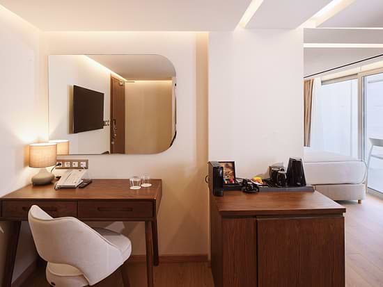 Contemporary interior of Junior Suite at Leonardo Hotel Athens City Center
