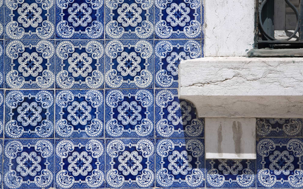 Tiled windowsill decorated with traditional Azulejo tiles, Lisbon, Portugal.