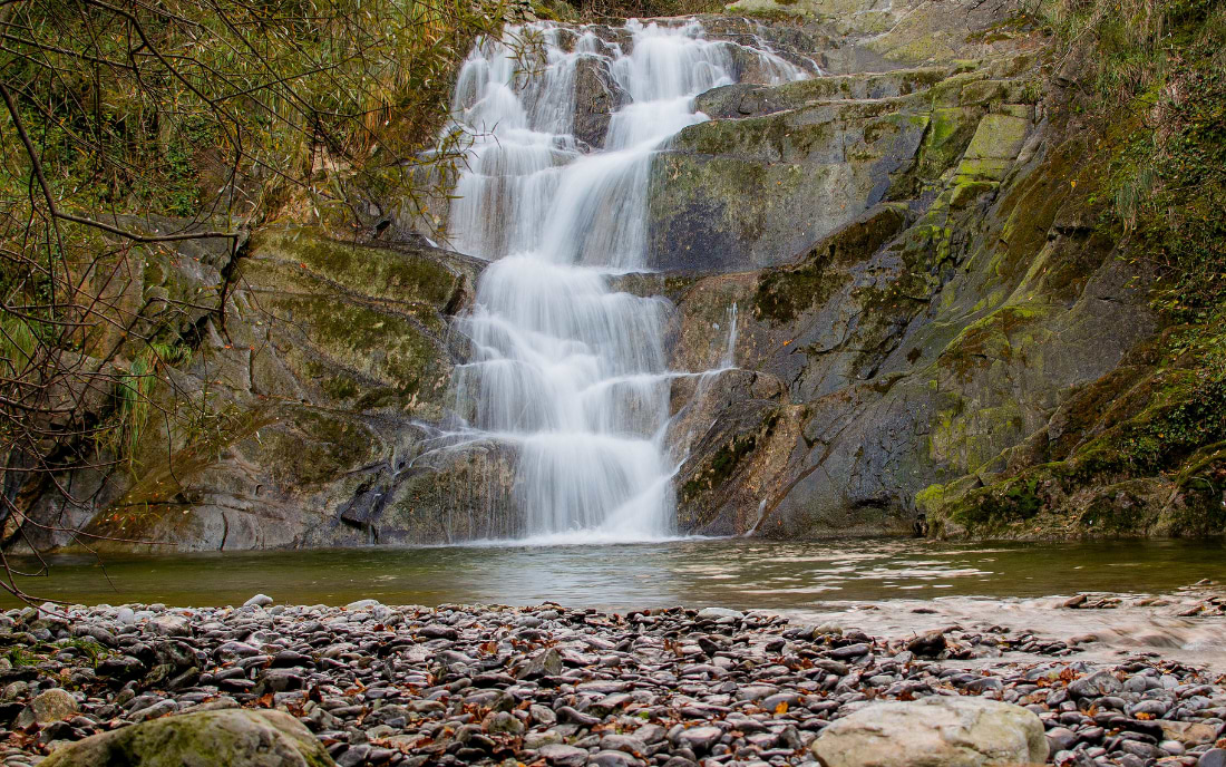 Waterfall in the Delika Natural Park near Bilbao in the Basque Country surrounded by rocks and greenery