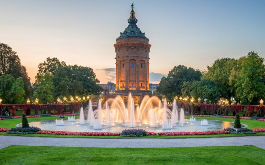 Water Tower (Wasserturm) with a fountain at dusk, Mannheim