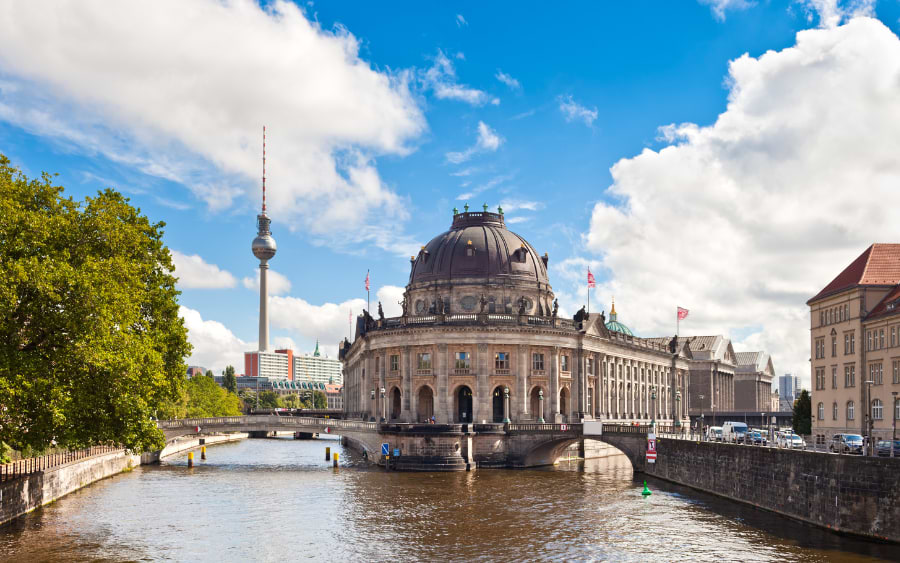 Explore Museum Island’s Stunning Architecture: The neoclassical façade of the Altes Museum with the TV Tower in the background