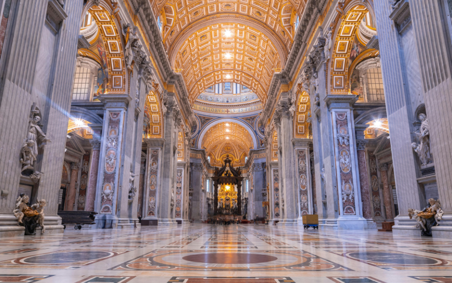 Interior view of the Basilica of San Zeno, showcasing its Romanesque architecture and ornate frescoes.