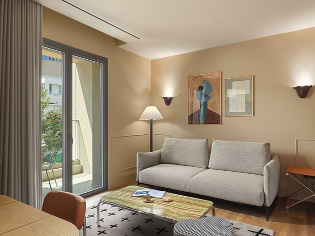 Executive Suite with lounge area and balcony at Leonardo Boutique Hotel Venetian Nicosia.
