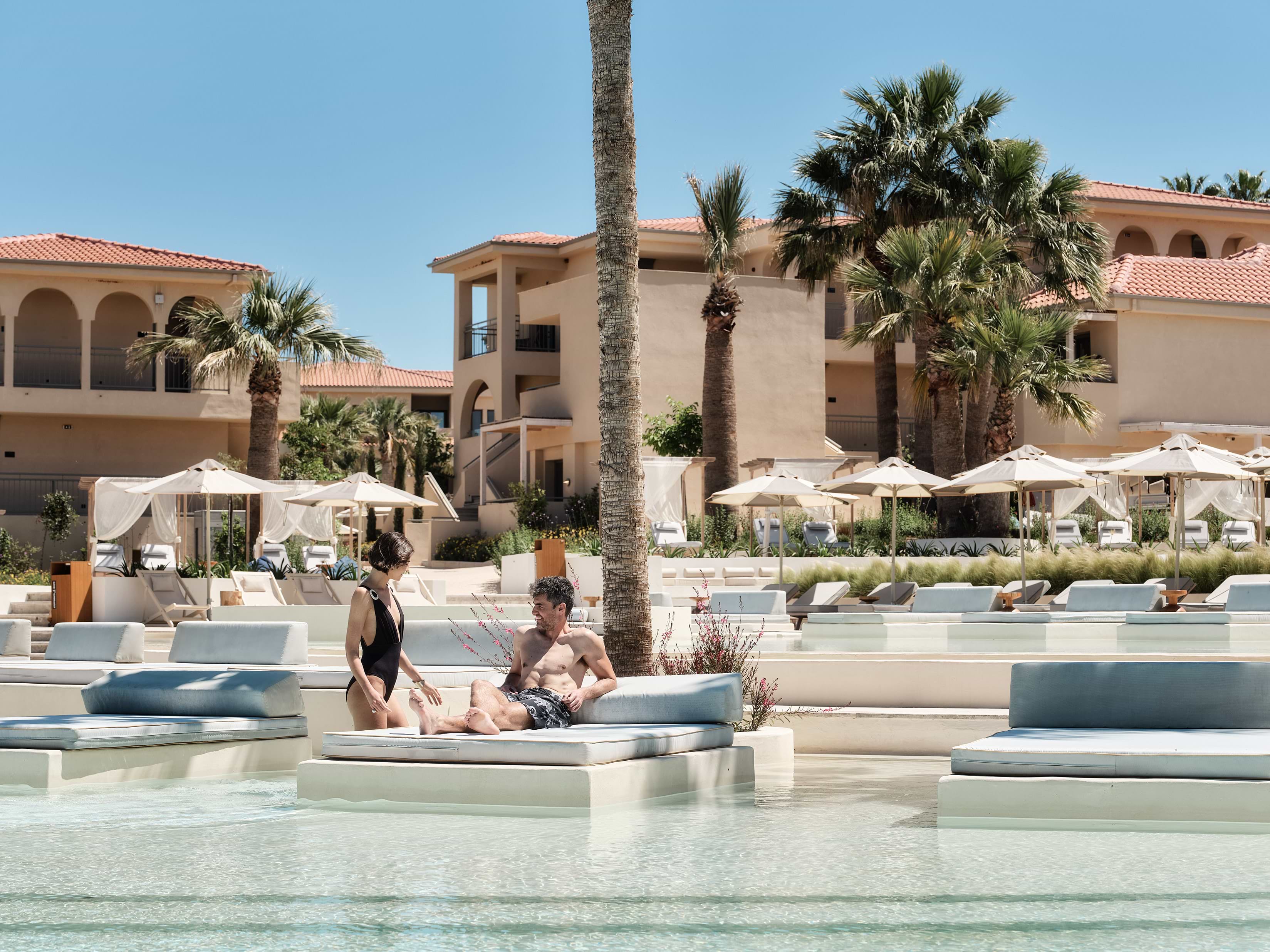 Couple relaxing at the pool at Meravia Resort 