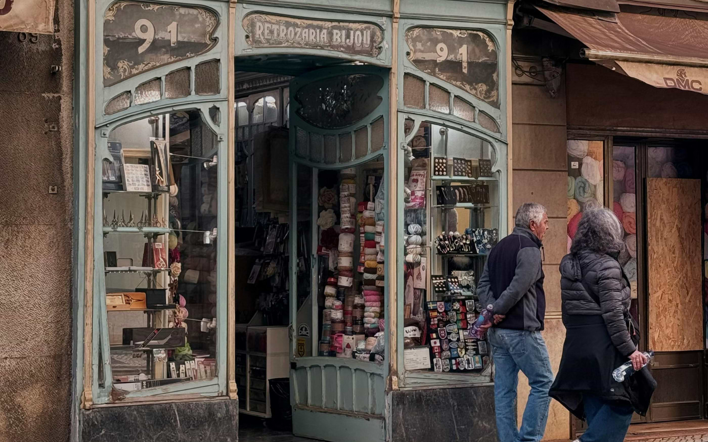 Historic Art Nouveau haberdashery shop Retrozaria Bijou in Portugal, with colorful yarns and sewing supplies displayed.