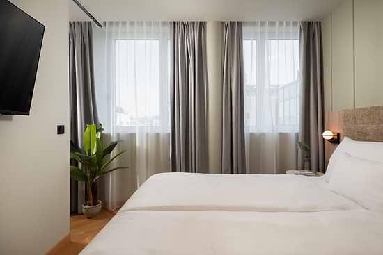 Deluxe One Bedroom with Single Sofabed - Bed