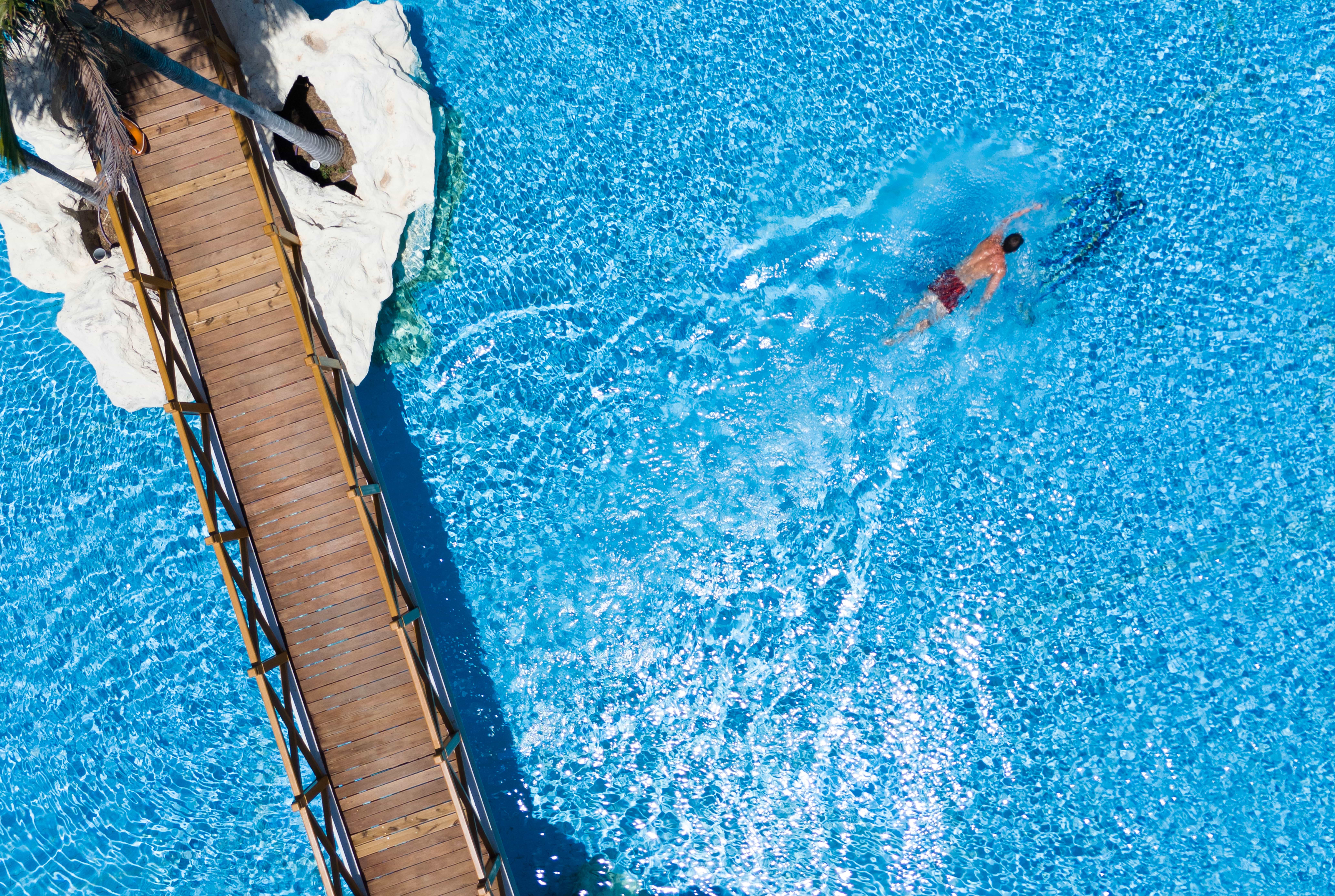 ariel photo of a swimmer in a pool, SEAFOS Resort