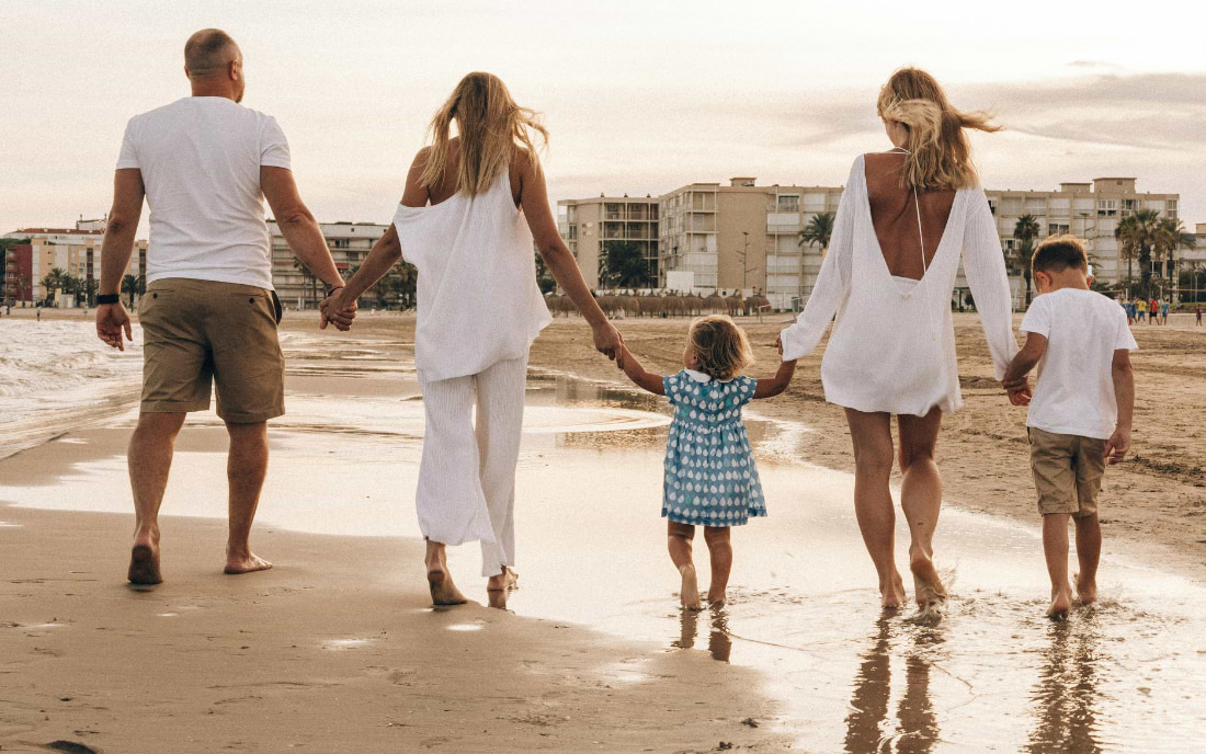 Family walking on the beach in Paphos, Cyprus, ideal destination for a family holiday