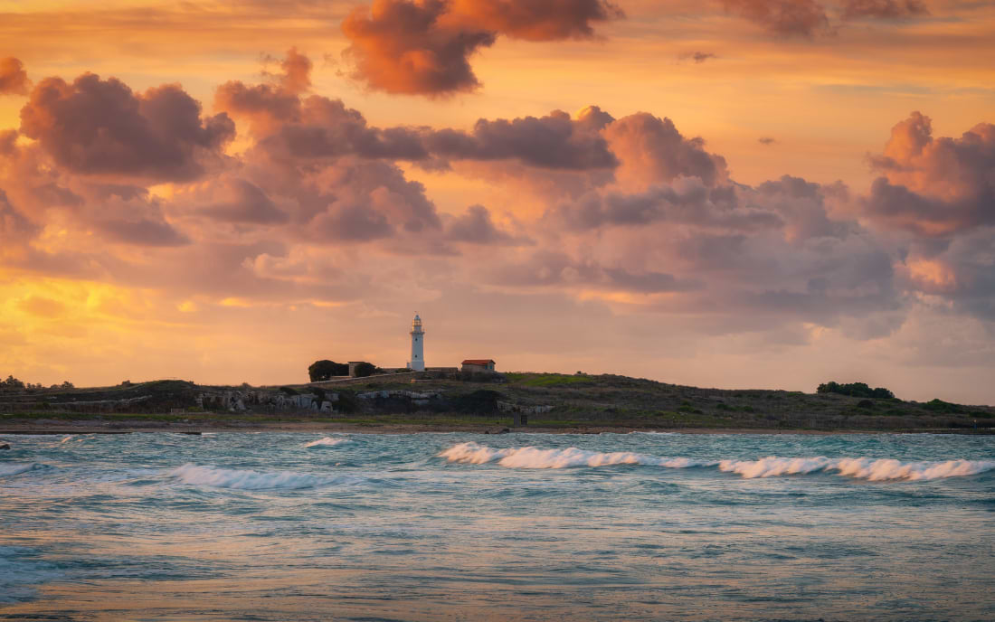 Paphos lighthouse at sunset over the Mediterranean Sea, Cyprus